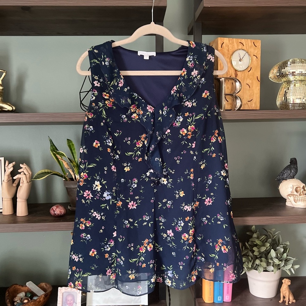 Marybelle - sleeveless navy blue floral flowy shirt with ruffles and tie in back